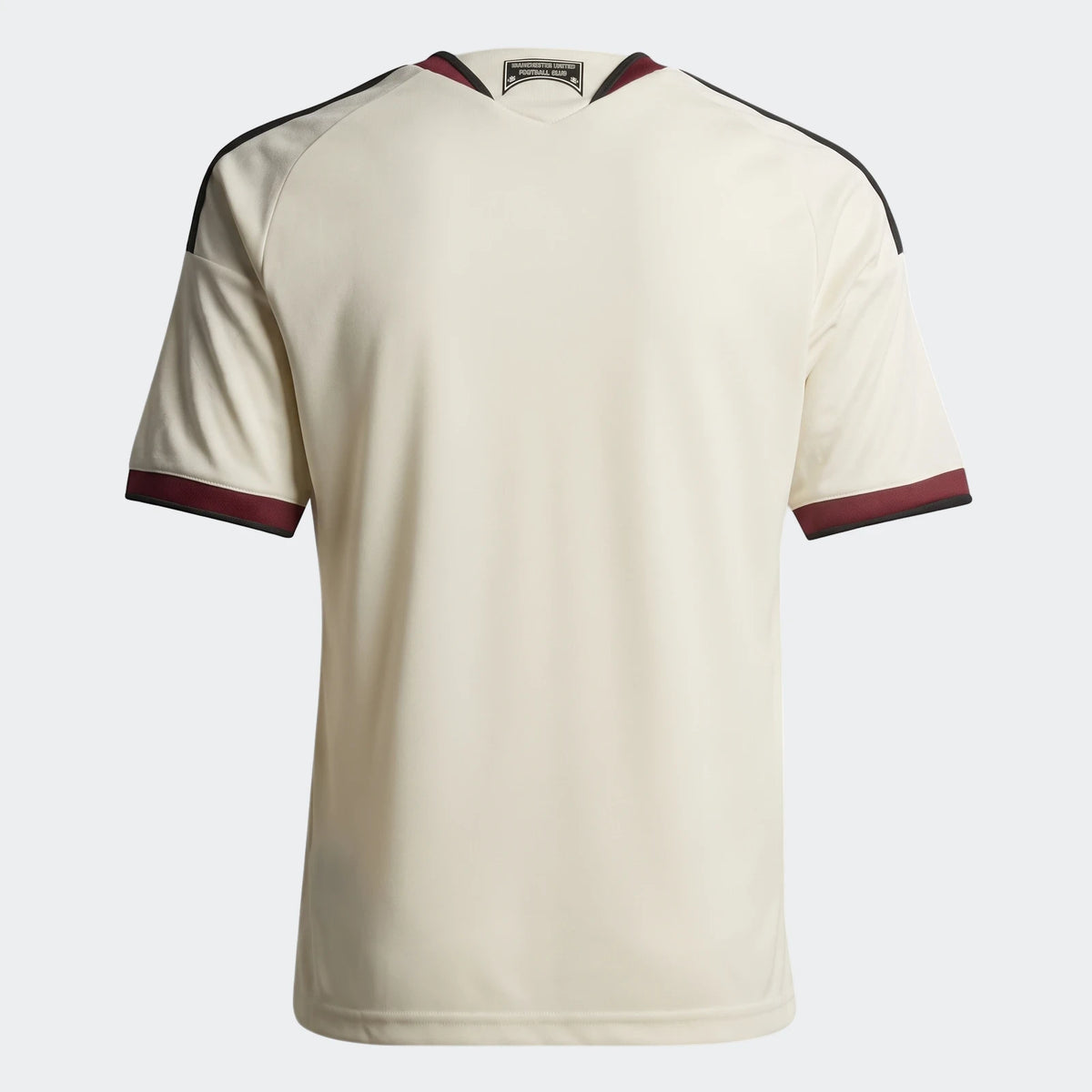 Back view of the Manchester United 26/27 Third Jersey for kids, featuring an off-white body with maroon and black trim.