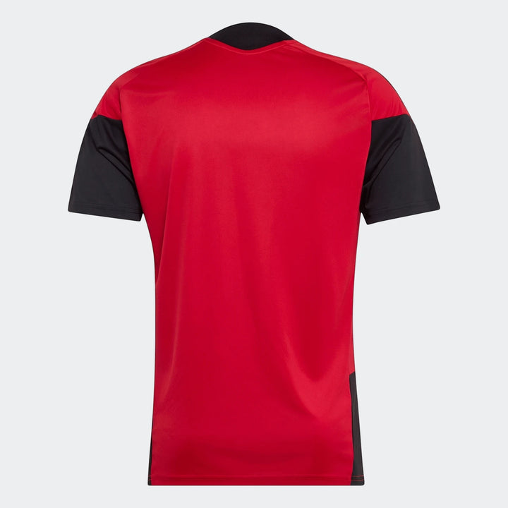 Back view of the Manchester United 26/27 Tiro Training Jersey, featuring a red main body with black raglan sleeves and side