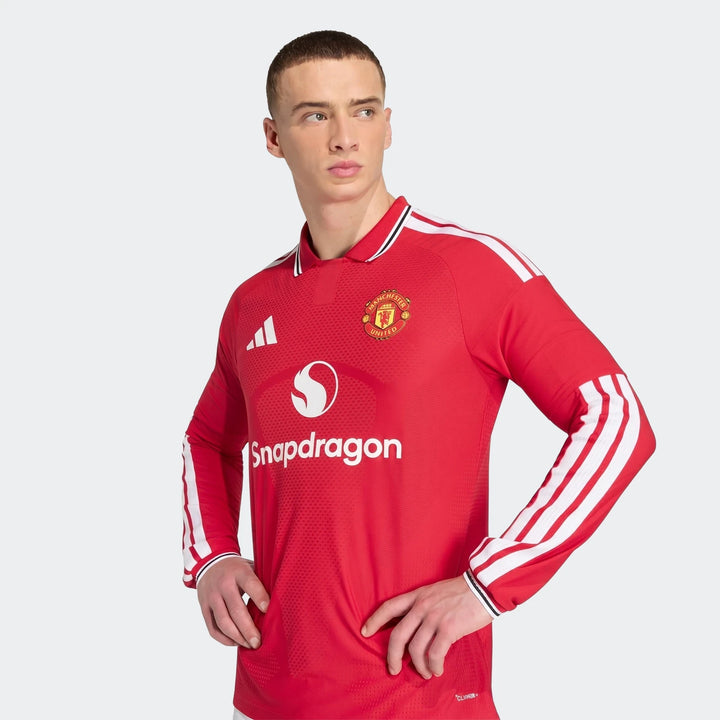 Manchester United 26/27 Authentic Long Sleeve Home Jersey in red with club crest, polo collar and white sleeve stripes.