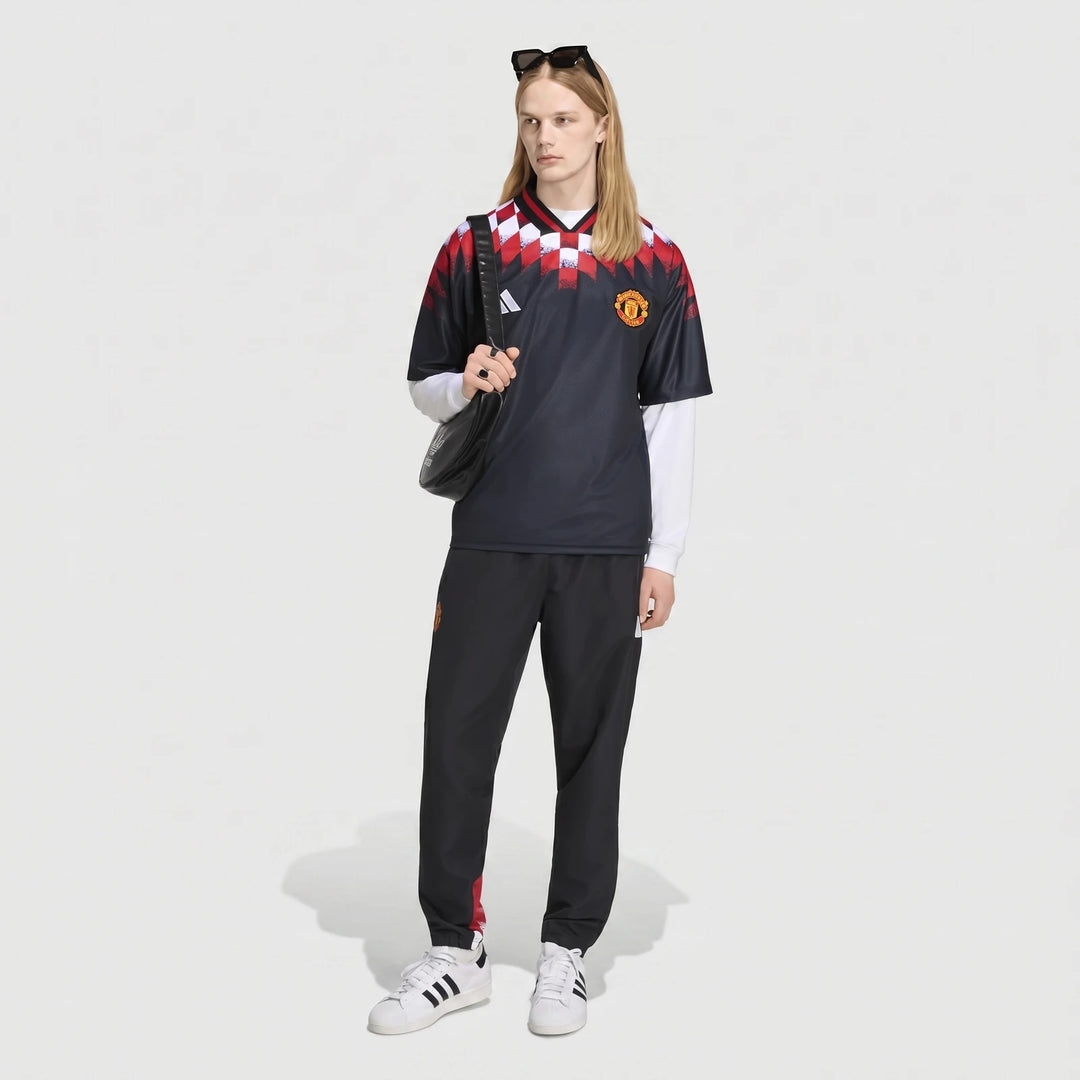 Manchester United Street Jersey in black with red and white checkered shoulder pattern, front view.