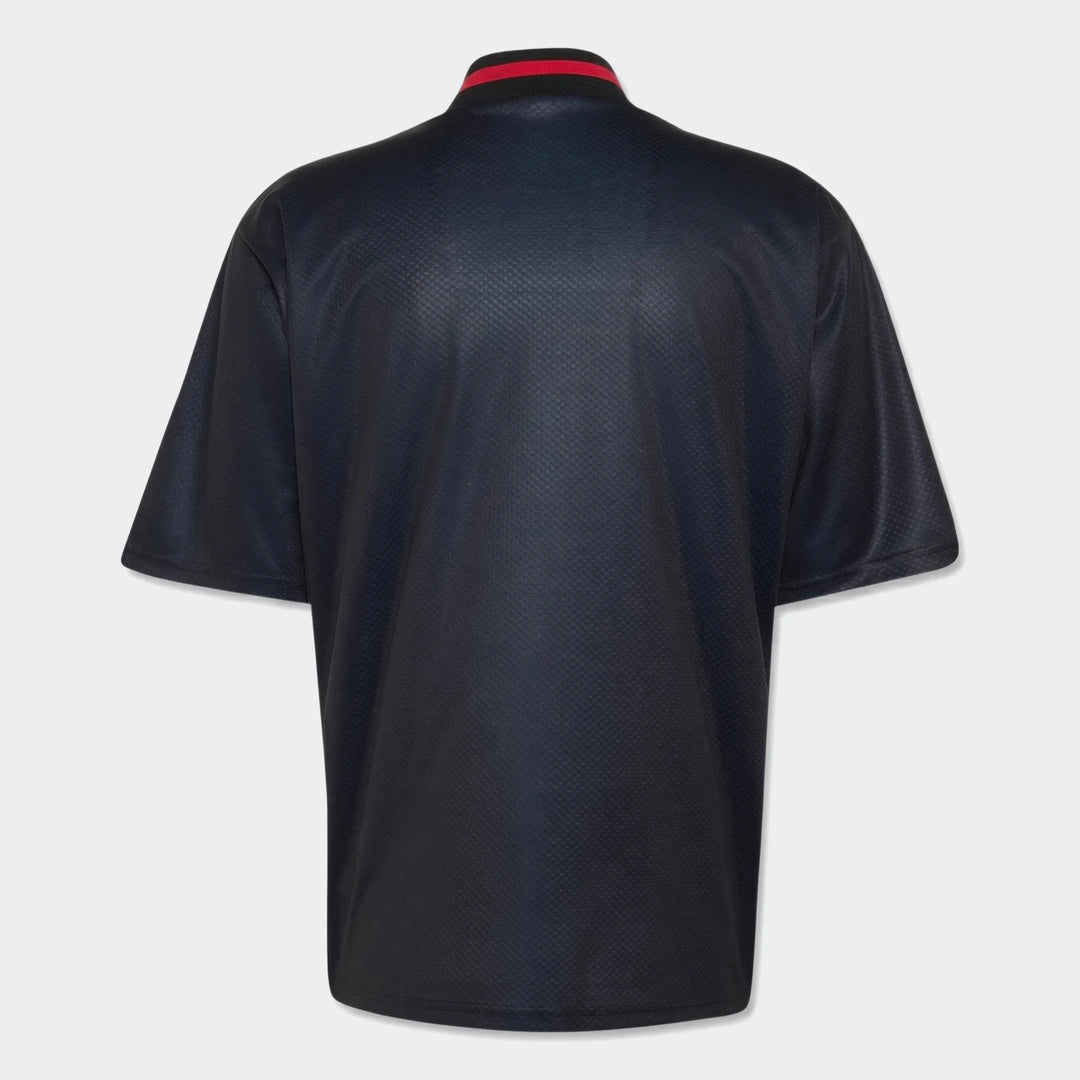 Manchester United Street Jersey in dark navy, back view, short-sleeve with red-striped ribbed collar.