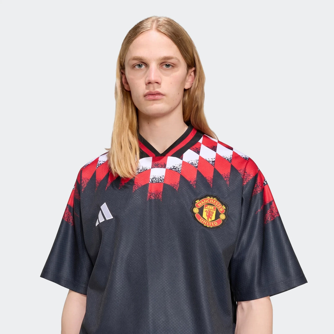 Manchester United Street Jersey in dark navy with red and white checkered shoulder print, short sleeves, front view