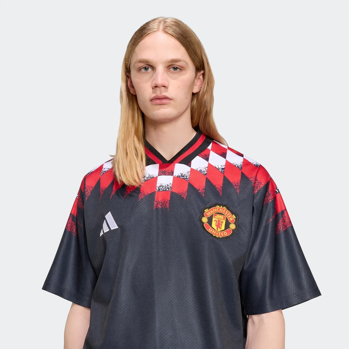 Manchester United Street Jersey in dark navy with red and white checkered shoulder print, short sleeves, front view