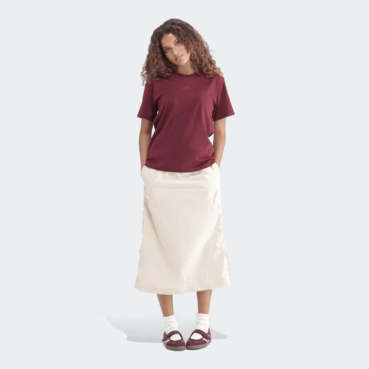 Maroon Slim Single Jersey T-Shirt worn by a model, paired with a beige long skirt, white socks, and maroon shoes, full body