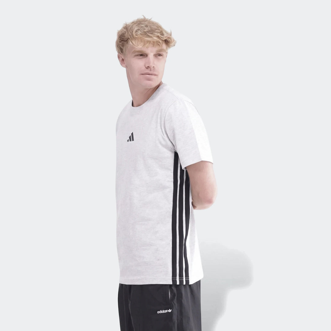 Men's 3-Stripes Single Jersey T-Shirt in light grey marl, worn by a model. Features a small Adidas logo on the chest and
