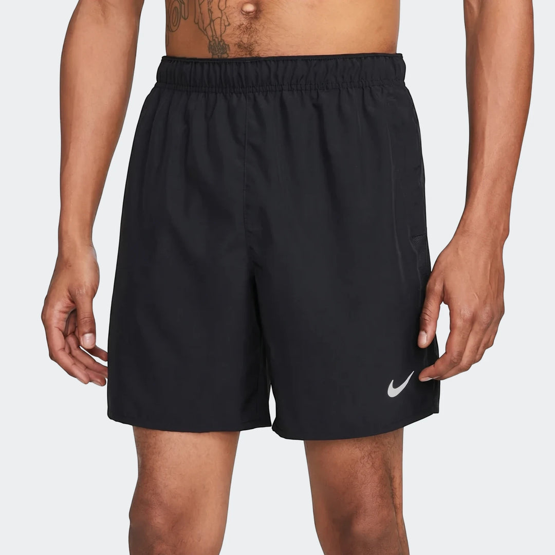 Men's black Nike running shorts, featuring a white swoosh logo, worn by a man against a plain background, front view.