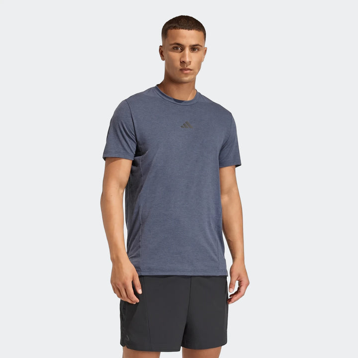 Men's blue D4T short-sleeve t-shirt and black shorts, modeled from the waist up.