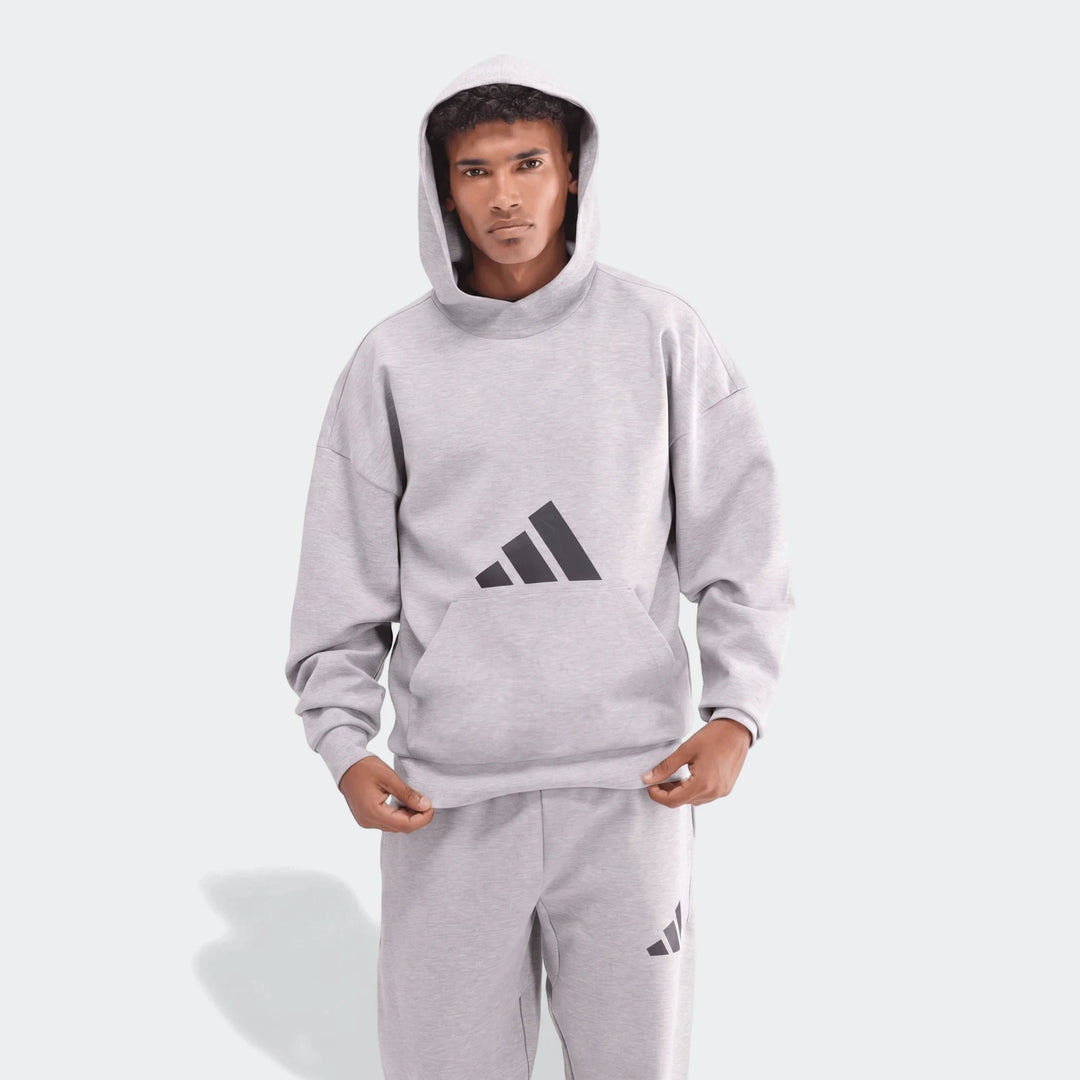 Men's light gray Adidas Future Icons 3-Bar Hoodie and matching sweatpants, front view, modeled on a male.