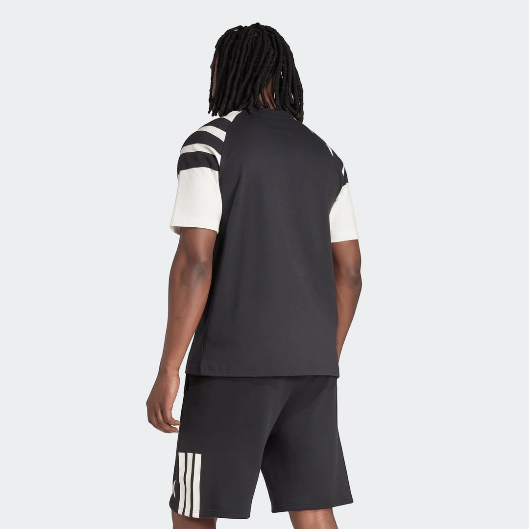 Men's New Zealand Rugby Leisurewear T-shirt in black with white striped sleeves, paired with black shorts, viewed from the