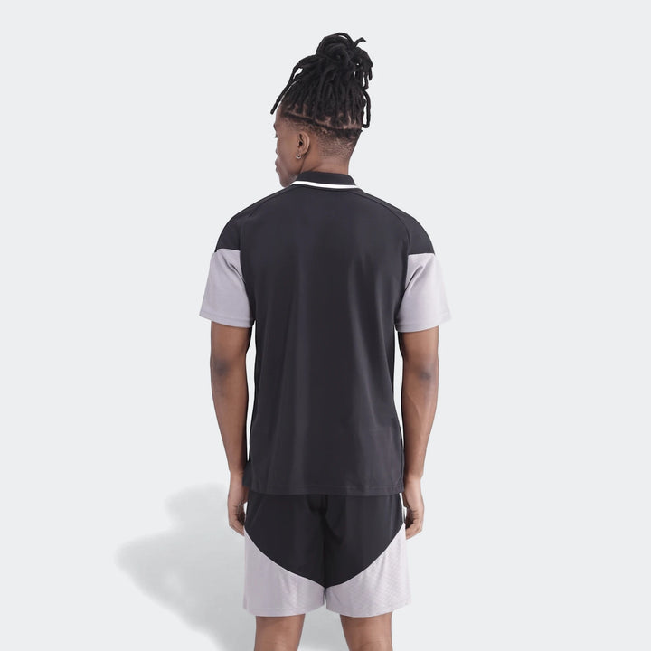 Men's Op Tiro26C Polo in a black and grey color-block design, featuring short sleeves and matching shorts, seen from the