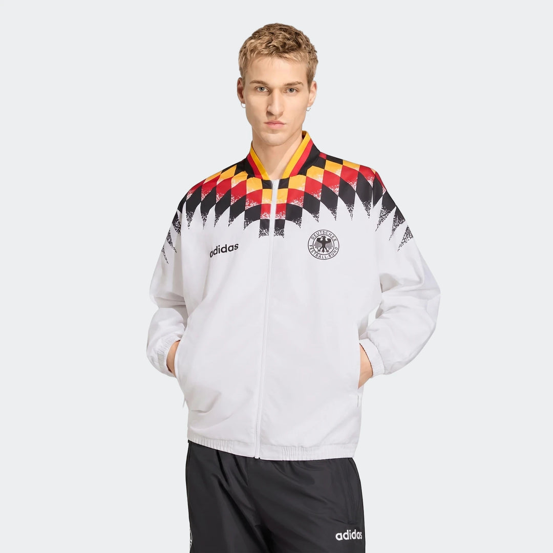 Men's white Adidas Germany 1994 Retro Track Top, featuring black, red, and yellow checkered pattern and DFB crest, modeled