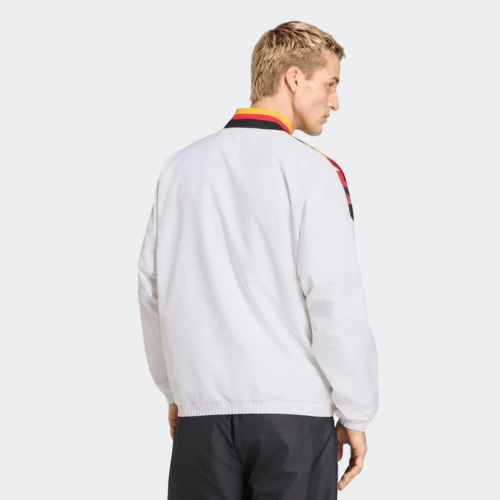 Men's white Germany 1994 Retro Track Top, featuring red, yellow, and black details on the collar and shoulders, seen from