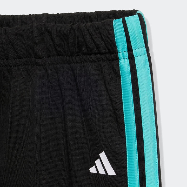 Close-up view of Mercedes-Amg Petronas Formula 1 Team DNA baby jogger set pants, featuring black fabric with turquoise side
