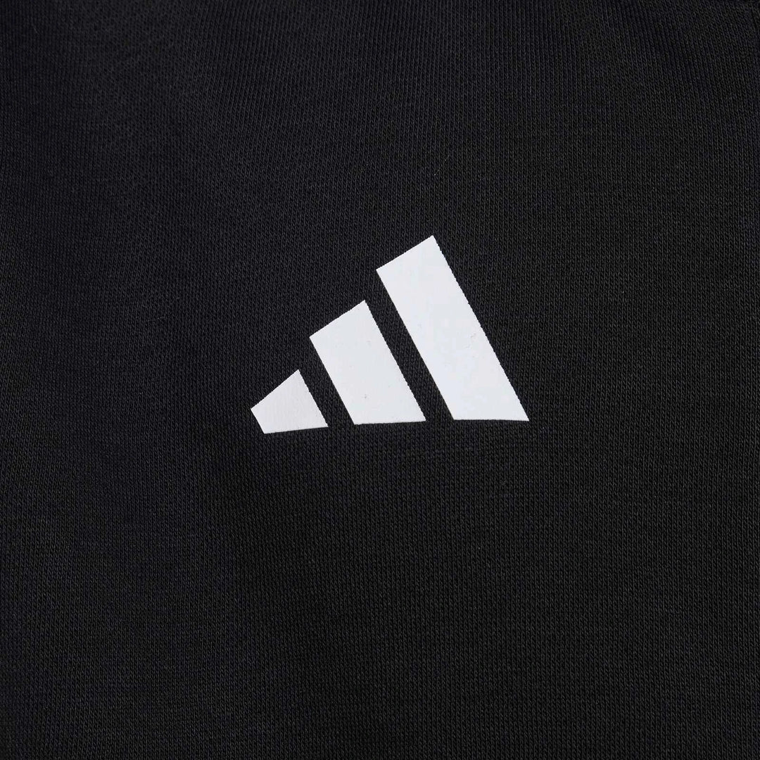 Close-up of a black Mercedes-Amg Petronas Formula 1 Team Dna Full-Zip Hoodie for kids, featuring a white Adidas logo.