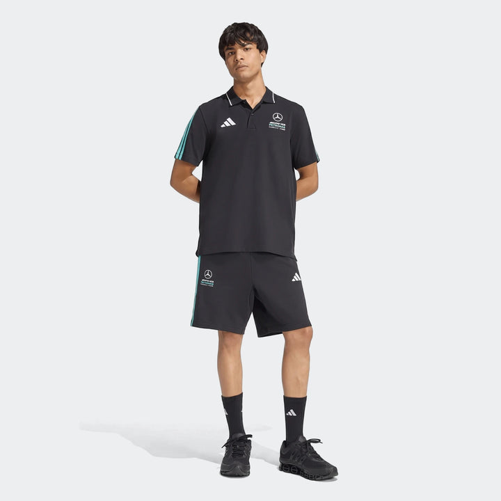 Men's black Mercedes-AMG Petronas Formula 1 Team DNA Polo Shirt with blue stripes and logos, paired with matching black