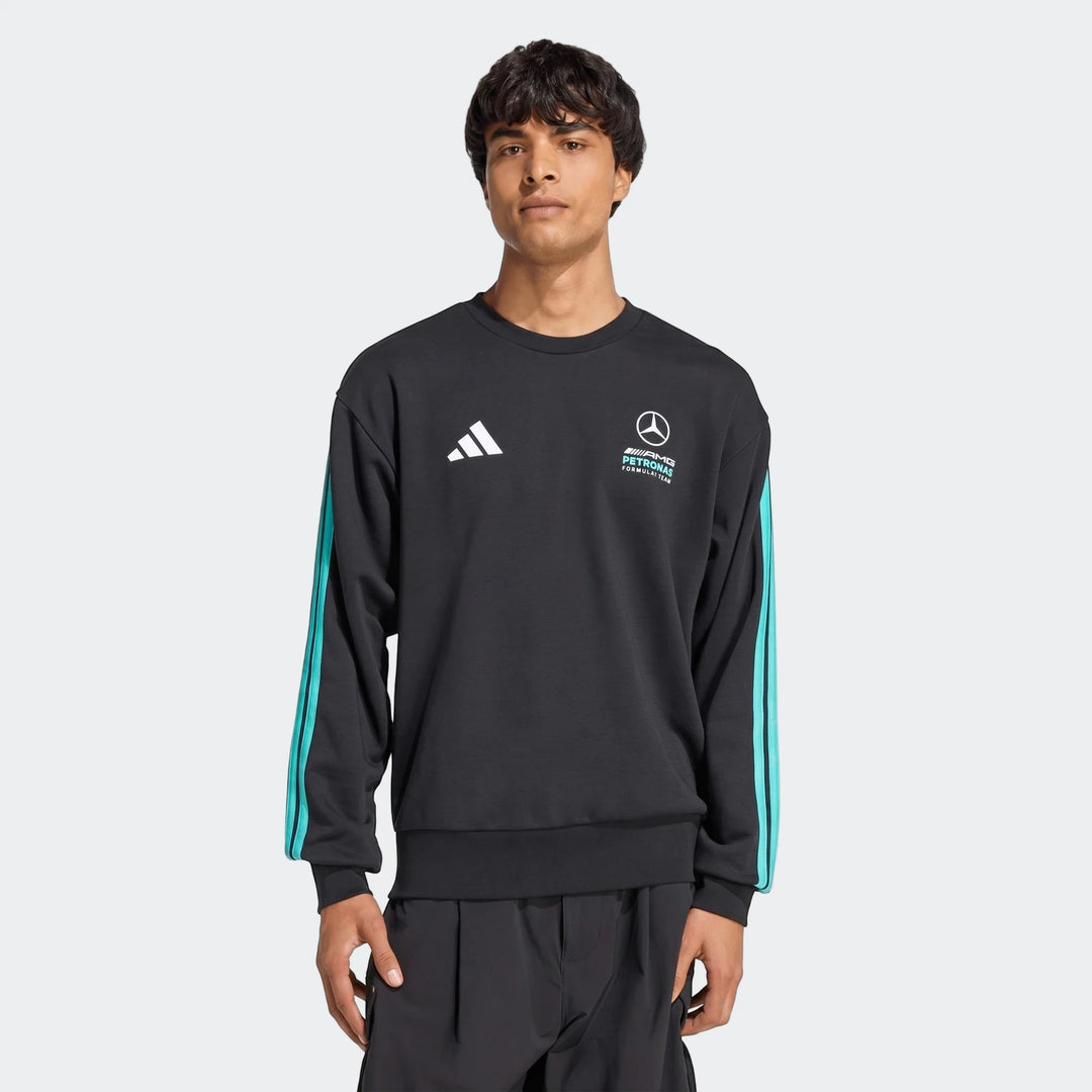 Men's black Mercedes-AMG Petronas Formula 1 Team DNA sweatshirt with long sleeves and teal stripes worn by a model.