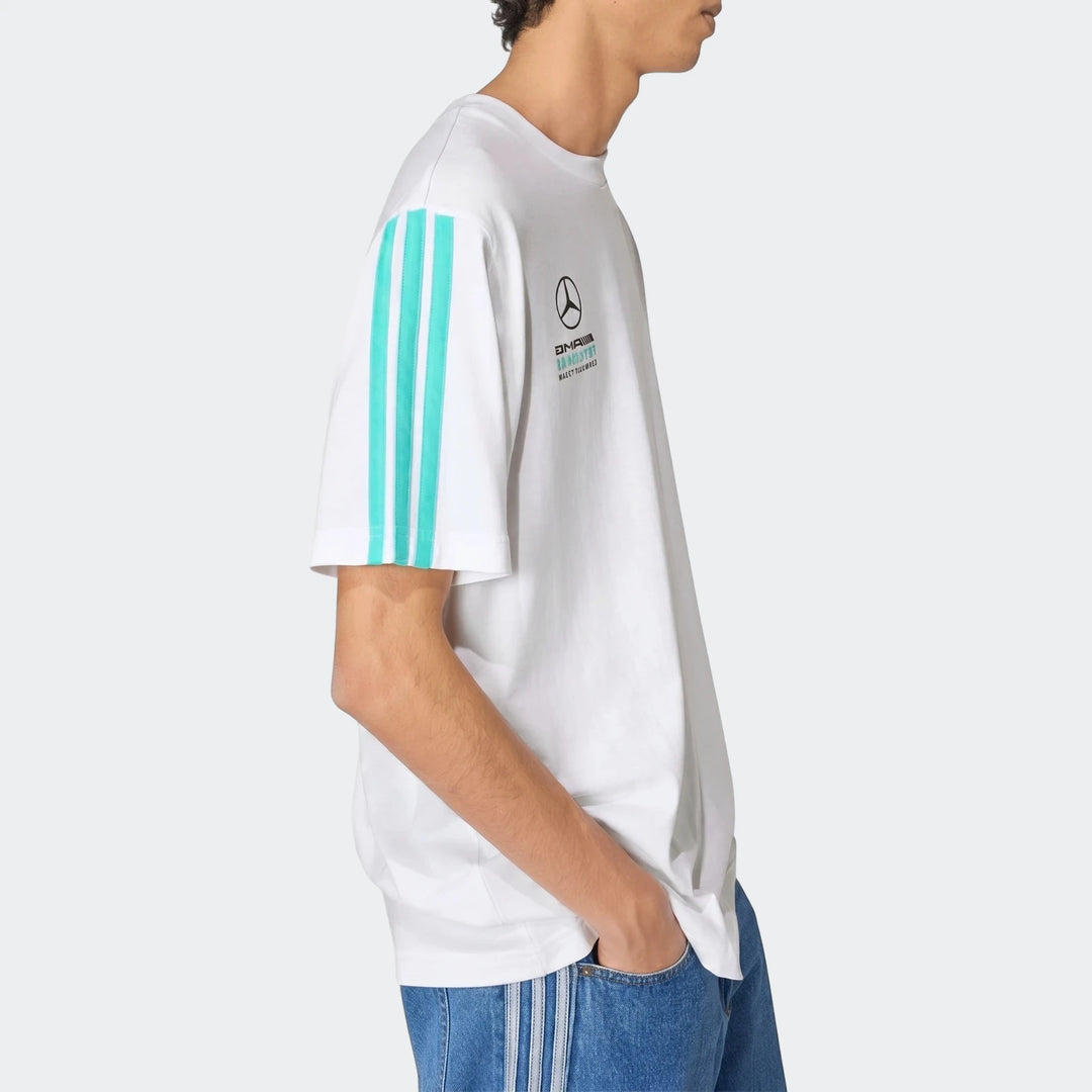 White Mercedes-Amg Petronas Formula 1 Team Dna T-shirt with turquoise sleeve stripes worn by a man in blue jeans, side