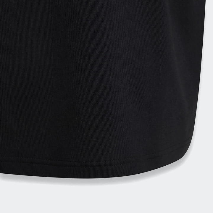 Close-up of the bottom hem of a Youth Mercedes-AMG Petronas Formula 1 Team Night T-Shirt in black ribbed fabric, showing the