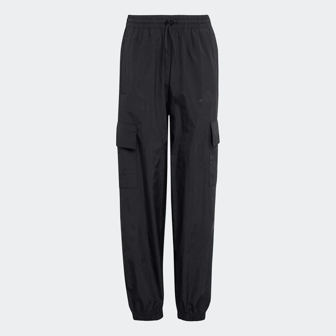 Black Mercedes-AMG Petronas Formula 1 Team Youth woven pants with cargo pockets on a studio background.