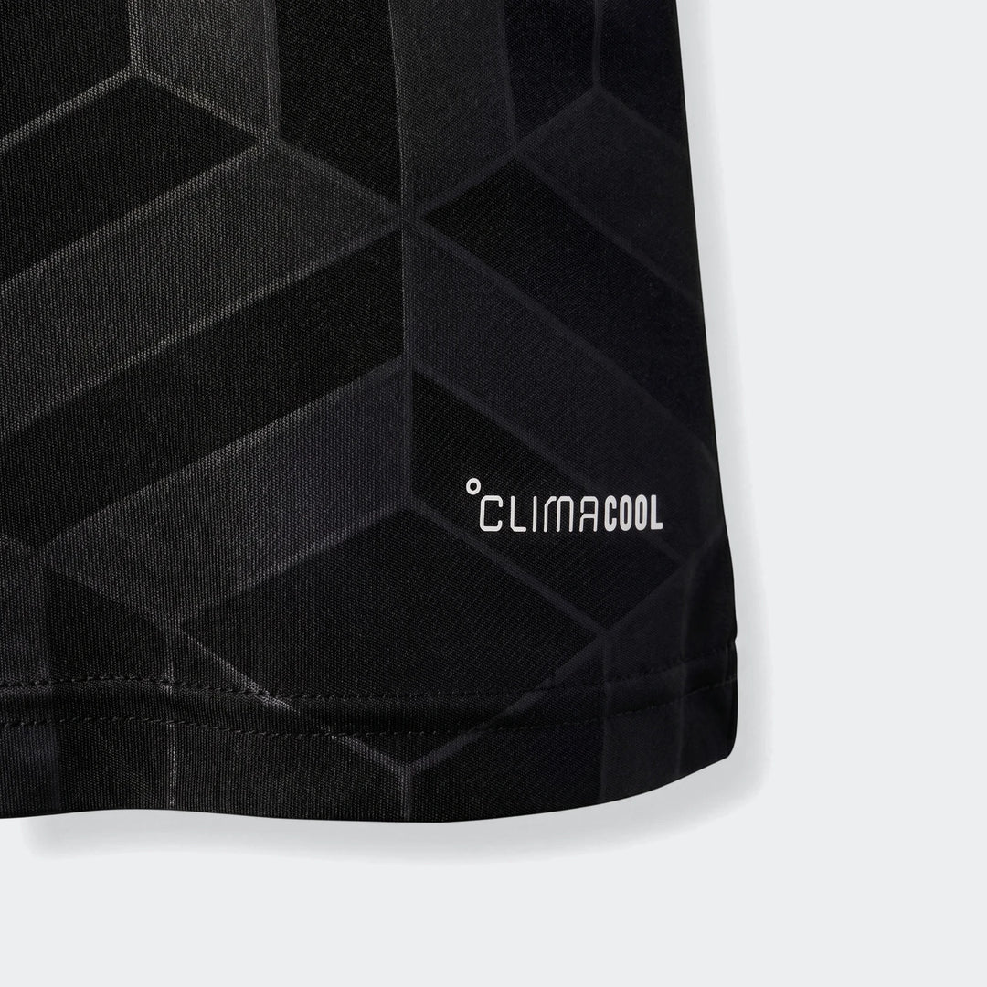 Close-up of a black Mercedes-Amg Petronas Formula 1 Team Driver Youth Jersey hem with white Climacool logo and geometric