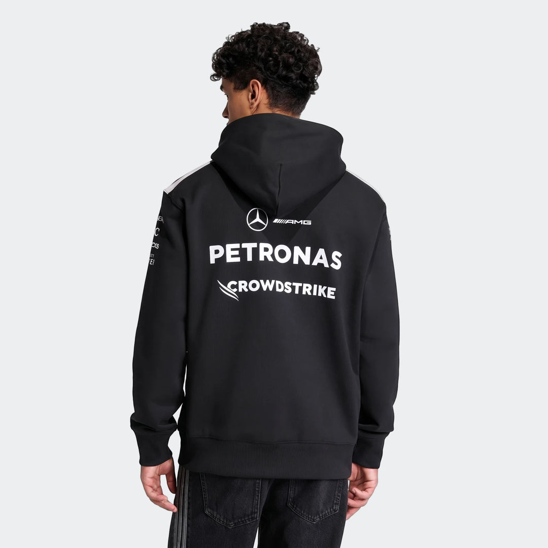 Mercedes-AMG Petronas Formula 1 Team Driver Hoodie for men, black with team logos on the back, worn by a model from the back.