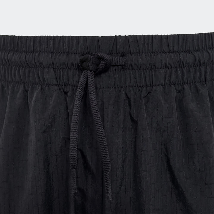 Mercedes-Amg Petronas Formula 1 Team Night Woven Pants Youth, black, featuring an elastic waistband and drawstring detail.