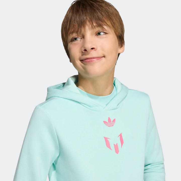 Youth Messi hoodie in light teal, featuring pink Adidas Trefoil and Messi logos, worn by a young boy.
