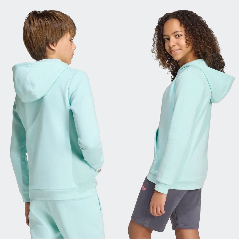 Two children, a boy and a girl, wear light blue Messi Hoodies and activewear. The boy wears light blue sweatpants, the girl