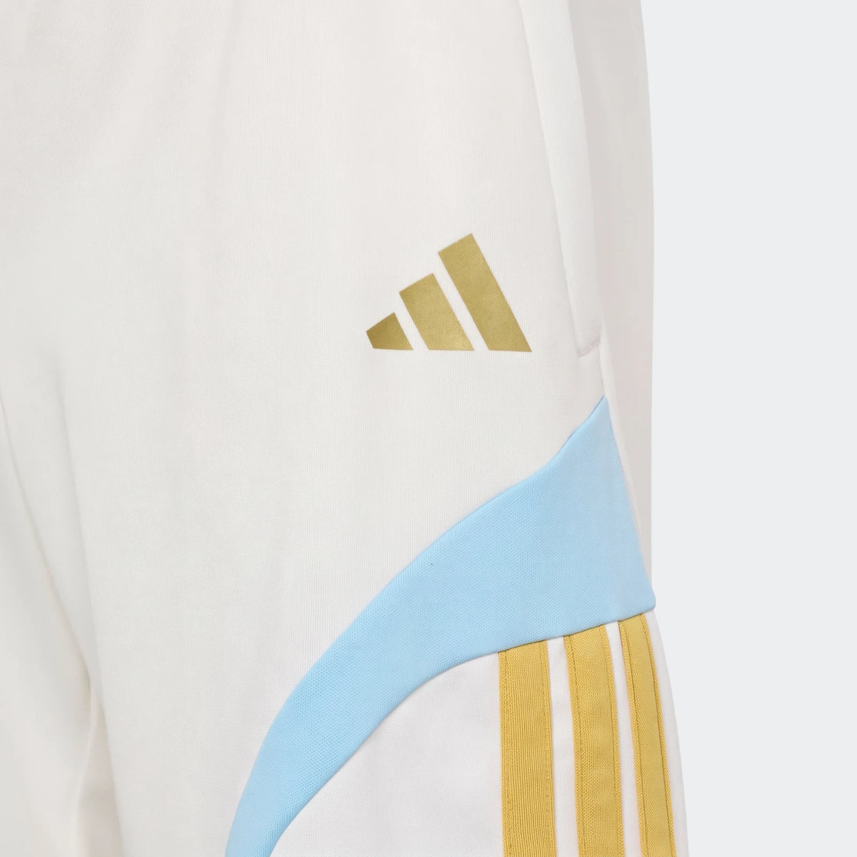 Close-up of Messi House Of Tiro Kids Shorts in white, featuring a gold Adidas logo, a light blue curved panel, and gold
