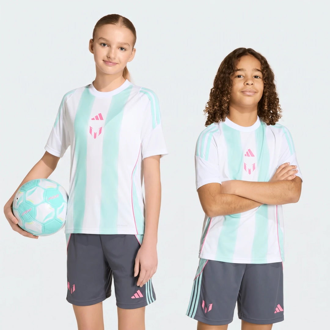 Two youth models, a girl and a boy, wearing white and mint green striped Messi training jerseys and gray shorts. The girl