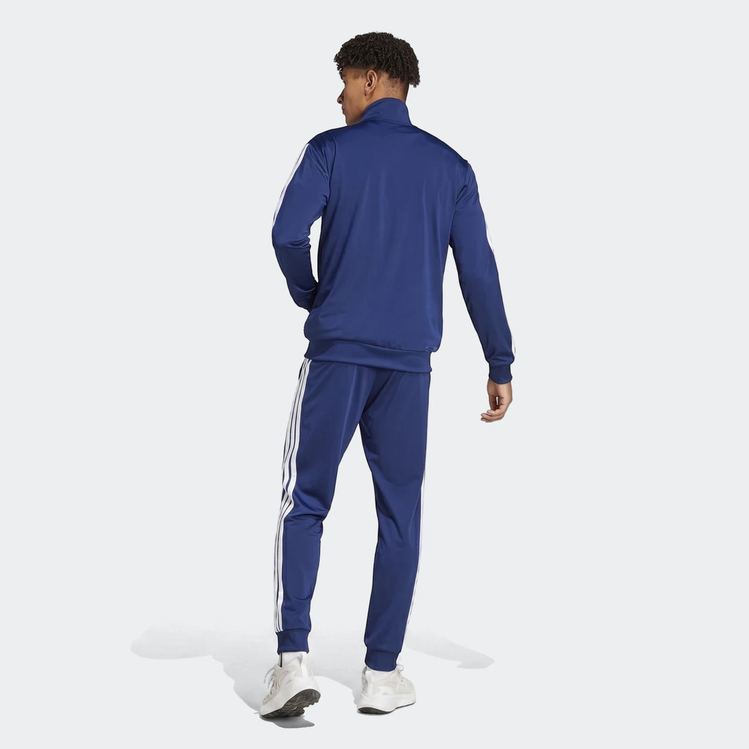 Navy blue Z.N.E. Track Top and matching track pants with white stripes, back view on a male model.