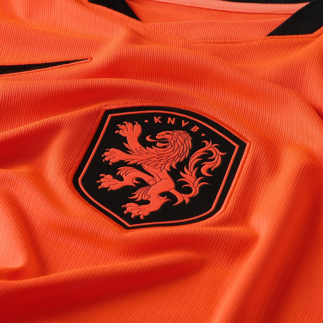 Close-up of an orange Netherlands National Team 2026 Stadium Home Men's Nike Dri-Fit Soccer Jersey, featuring the KNVB crest.