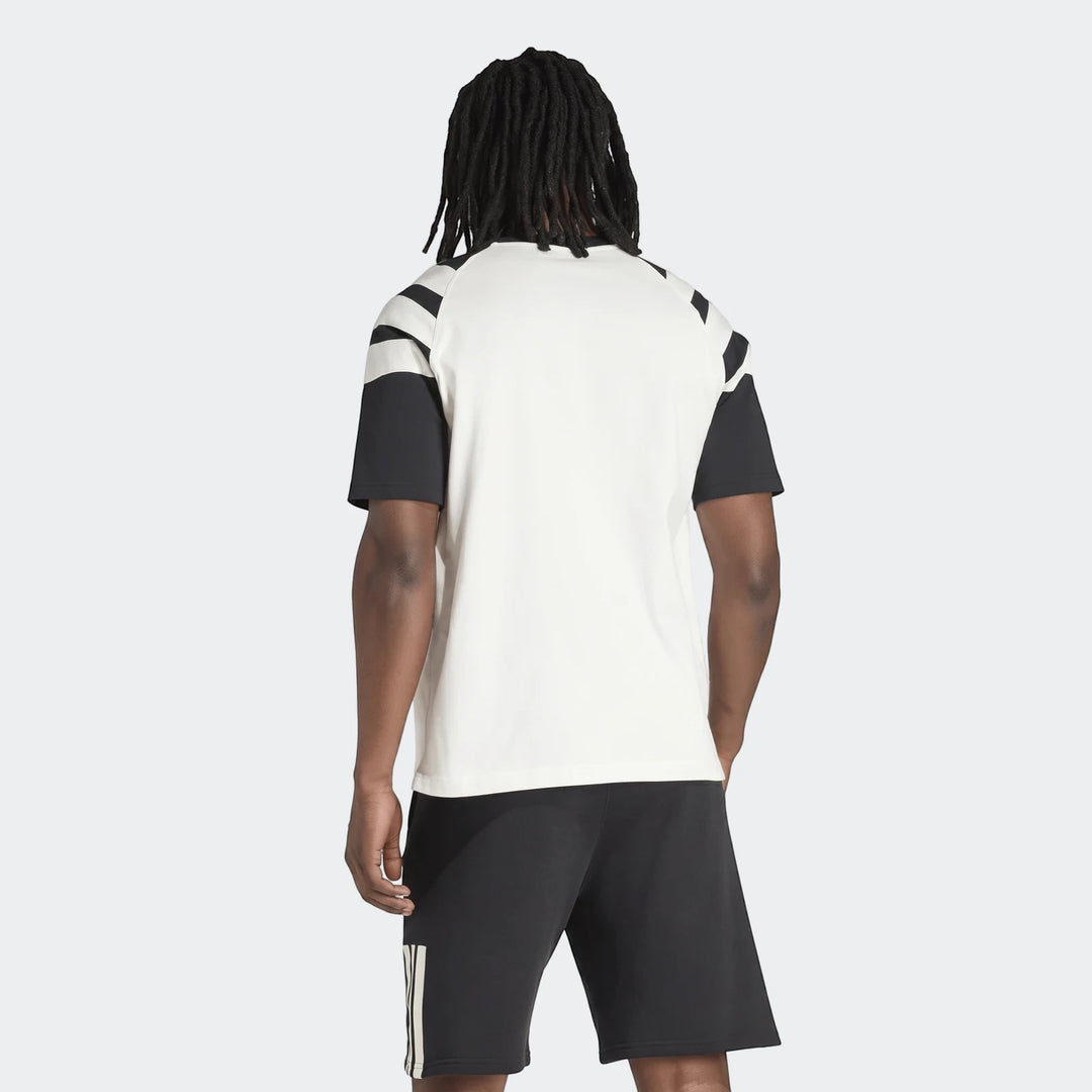 Back view of a men's New Zealand Rugby Leisurewear T-Shirt in off-white with black sleeves and stripes, worn with black