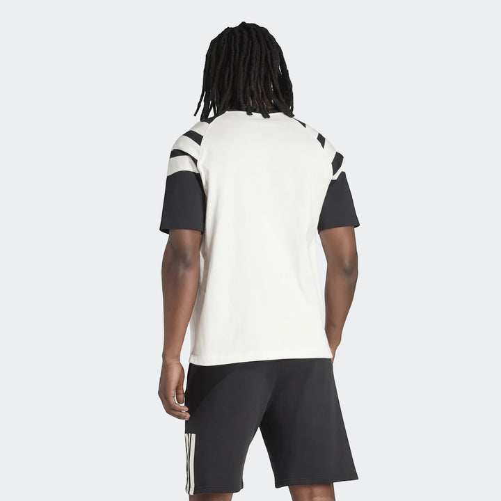 Back view of a men's New Zealand Rugby Leisurewear T-Shirt in off-white with black sleeves and stripes, worn with black