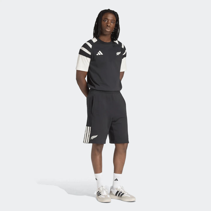 Men's New Zealand Rugby Leisurewear T-Shirt and shorts set, black with white details, worn by a male model in a full-body