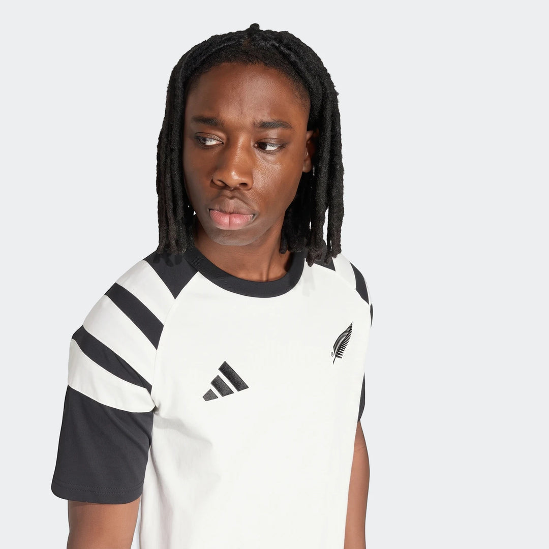 Men's New Zealand Rugby leisurewear t-shirt in black and white with round neck, featuring Adidas and Silver Fern logos, worn