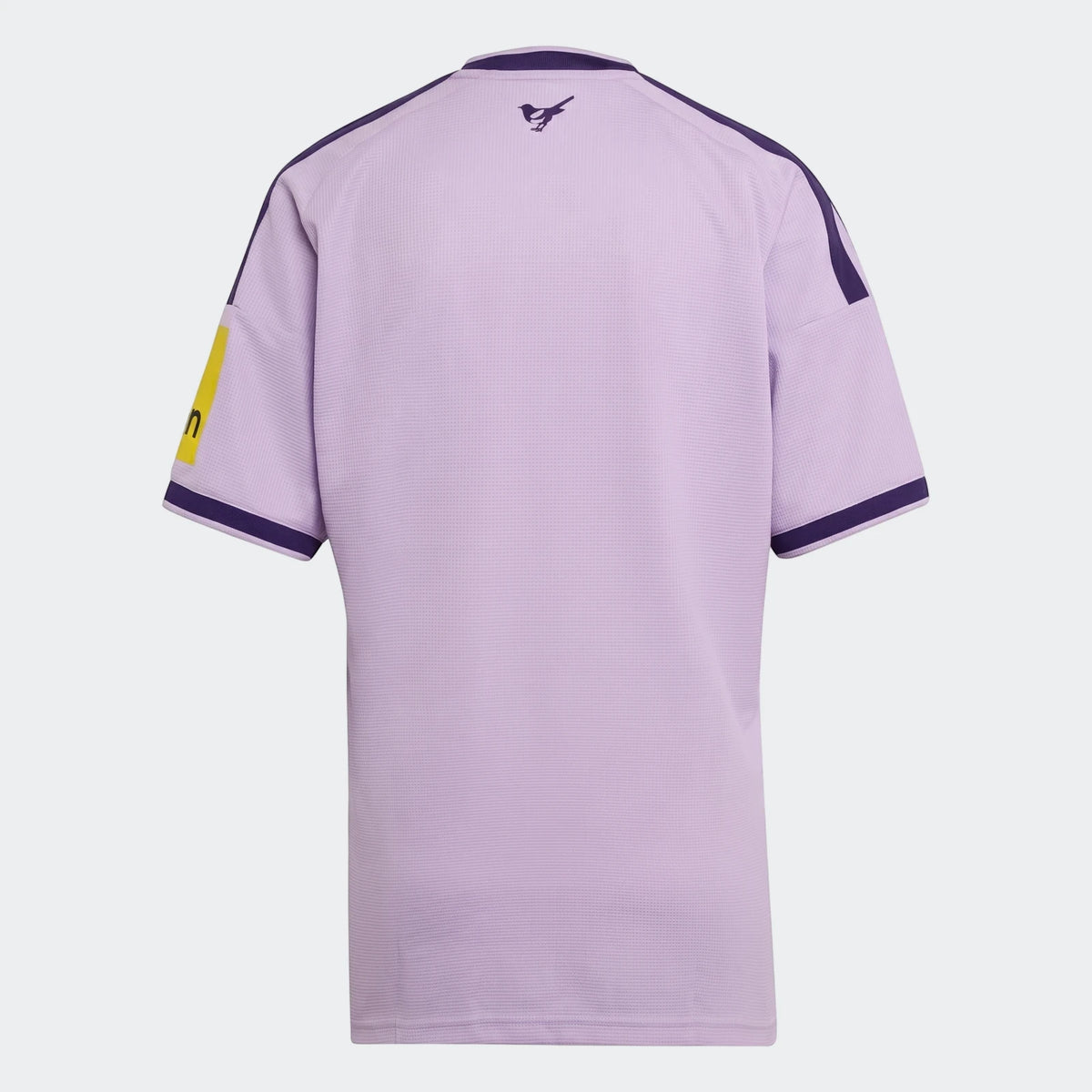 Newcastle United FC 26/27 third jersey in light purple, shown from the back with short sleeves and a magpie logo.