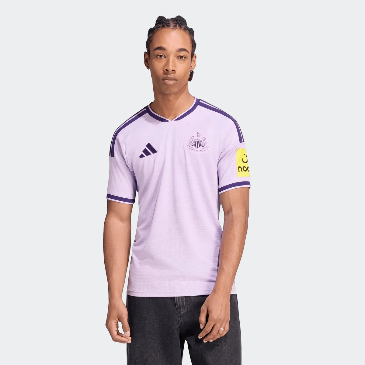 Newcastle United Fc 26/27 Third Jersey in lilac and purple, worn by a male model, front view.