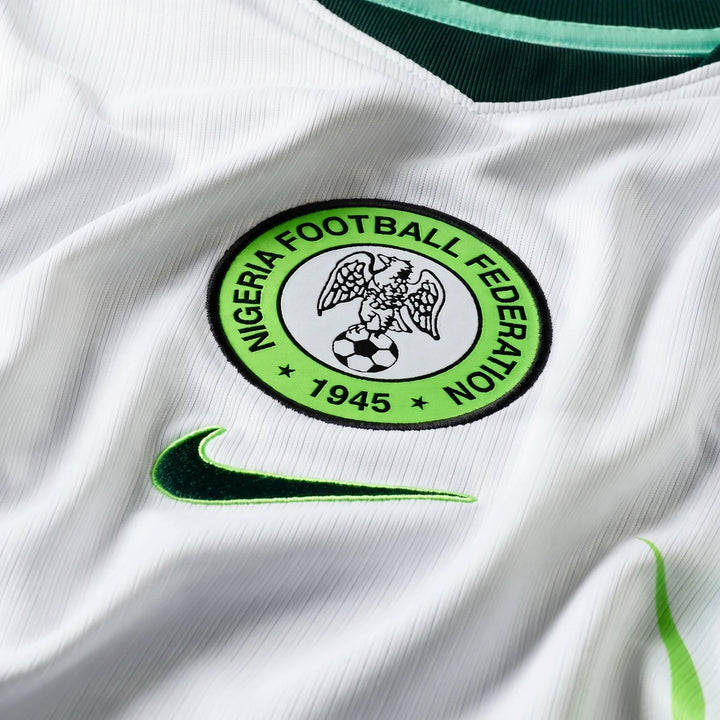 Close-up of a white Nigeria 2026 Stadium Away Men's Nike Dri-FIT Soccer Replica Jersey, featuring the Nigeria Football