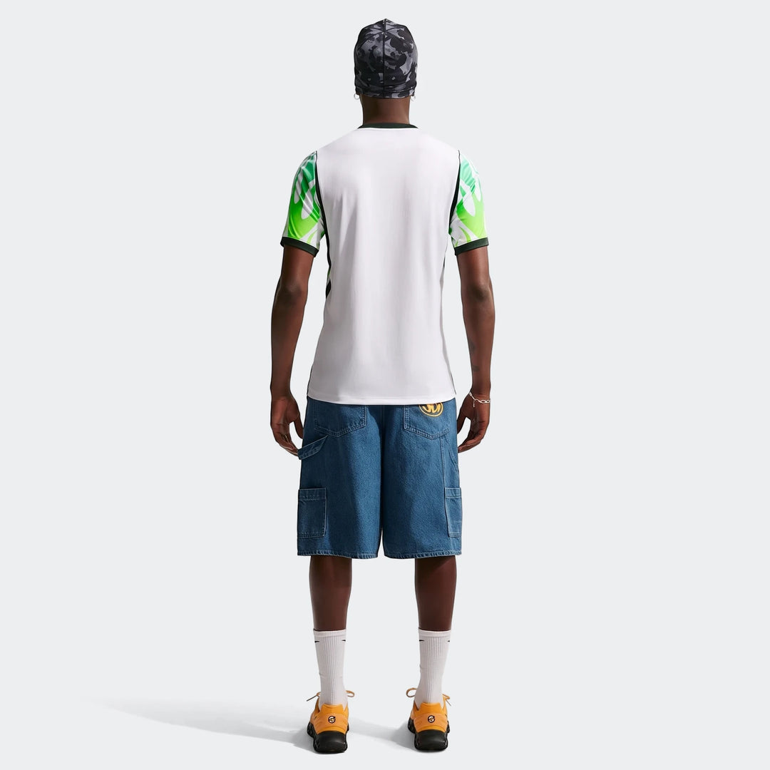 Rear view of a men's Nigeria 2026 Stadium Away Nike Dri-Fit Soccer Replica Jersey in white, green, and black worn by a model.