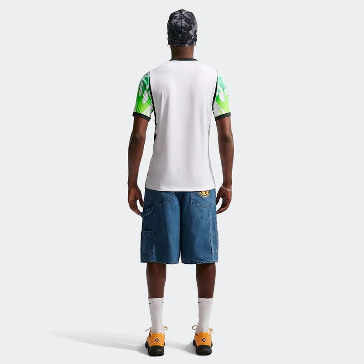 Rear view of a men's Nigeria 2026 Stadium Away Nike Dri-Fit Soccer Replica Jersey in white, green, and black worn by a model.