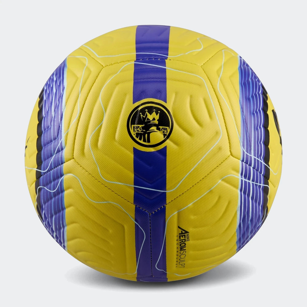 A vibrant yellow and blue Nike Academy FA24 soccer ball with intricate textured panels and branding, shown in a studio shot.
