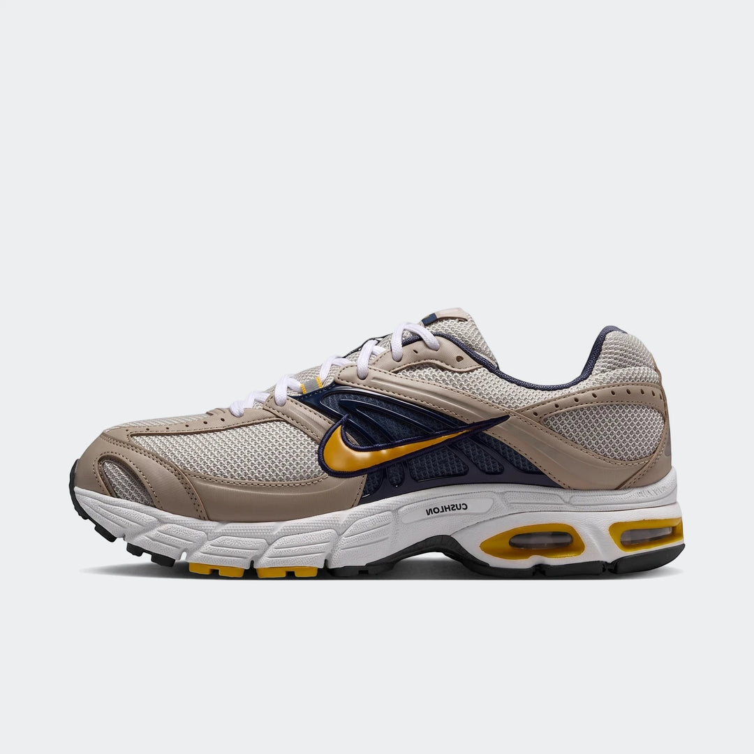 Side profile of Nike Air Max Moto 2K 2Tone Men's Shoes in beige, navy, and yellow with white laces and cushioned sole.