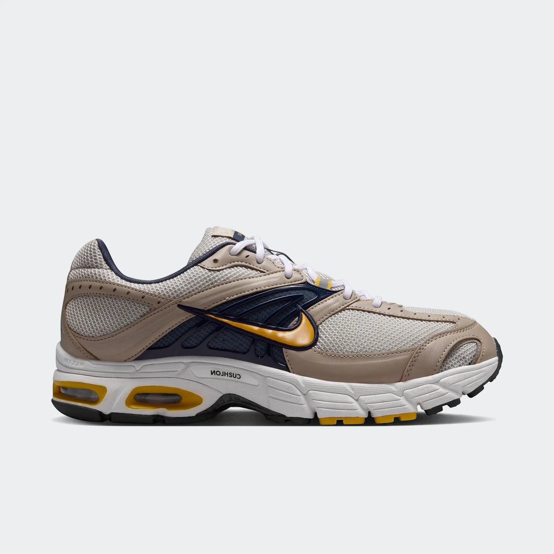 Side view of Nike Air Max Moto 2K 2Tone men's shoes in beige, dark blue, and yellow with mesh and synthetic upper.