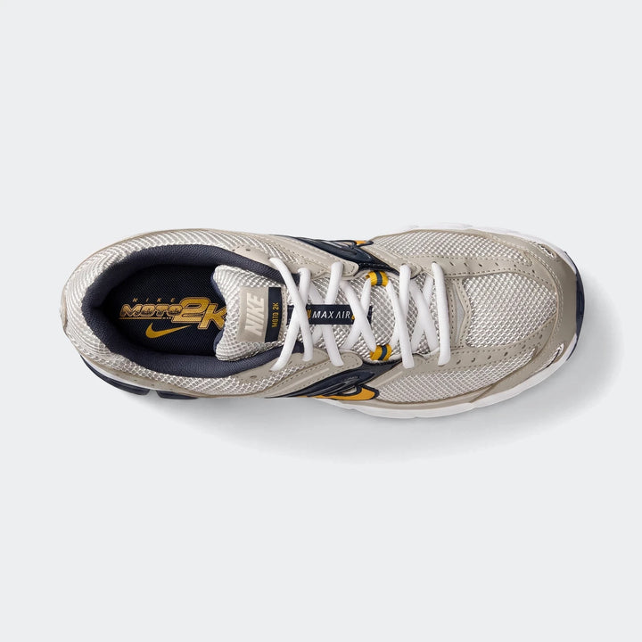 Nike Air Max Moto 2K 2Tone men's shoes in light grey, navy, and yellow, captured from a top-down perspective.