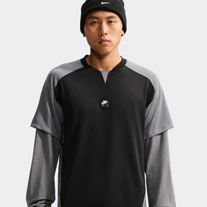 Nike Air Men’s Top in black with grey mesh sleeves, lightweight athletic shirt designed for active wear.