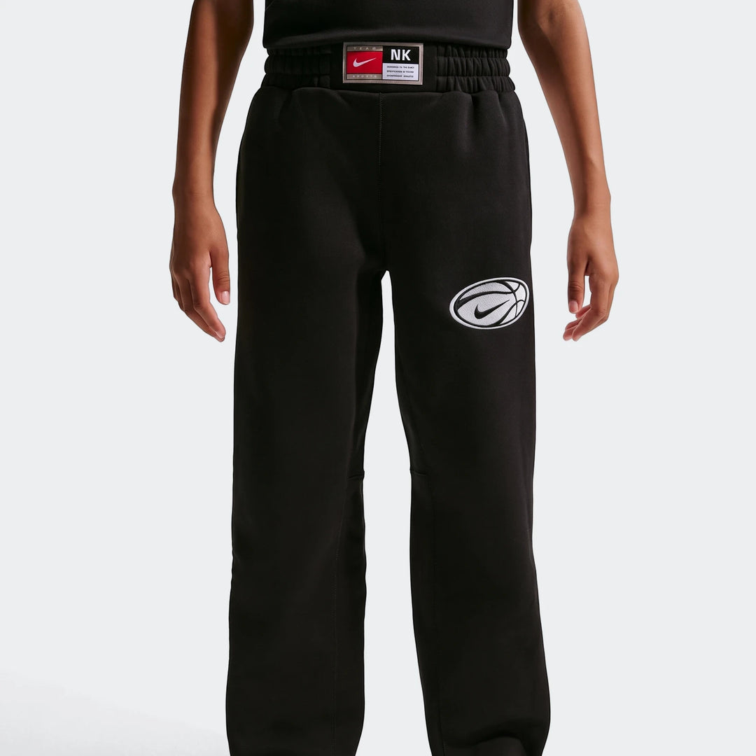 Nike Big Kids' basketball pants in black with an elastic waistband and a white Nike logo on the left thigh, designed for