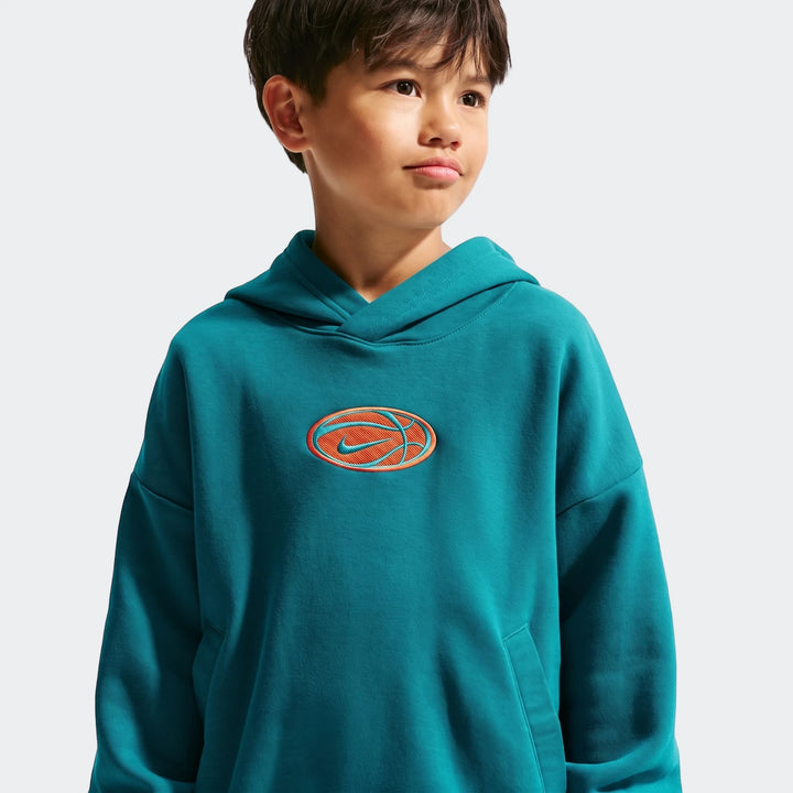 Young boy models a teal Nike Big Kids' Dri-Fit Basketball Hoodie with an embroidered basketball and swoosh logo on the
