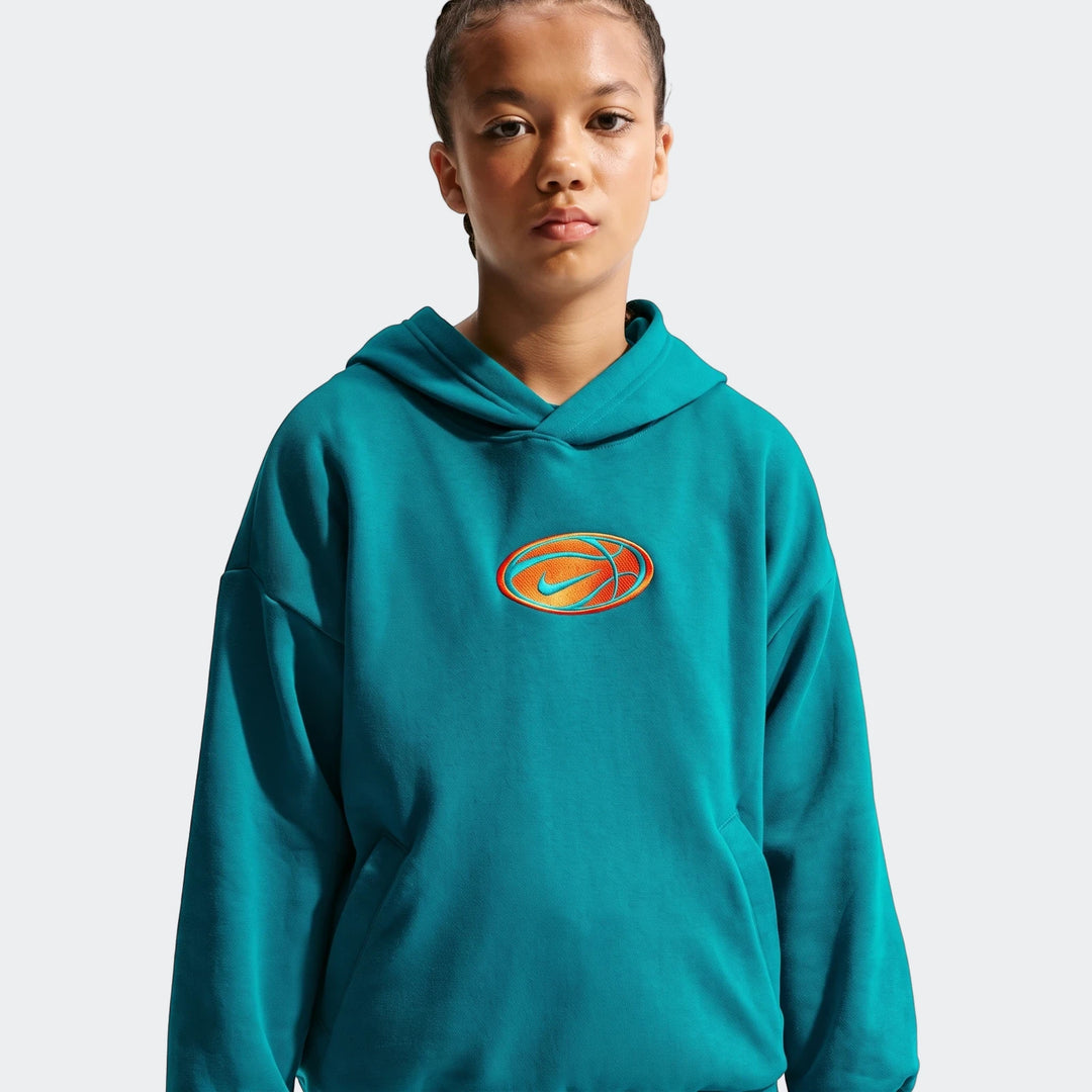 Nike Big Kids' Dri-Fit Basketball Hoodie in teal, featuring an embroidered orange and blue oval logo, modeled by a young