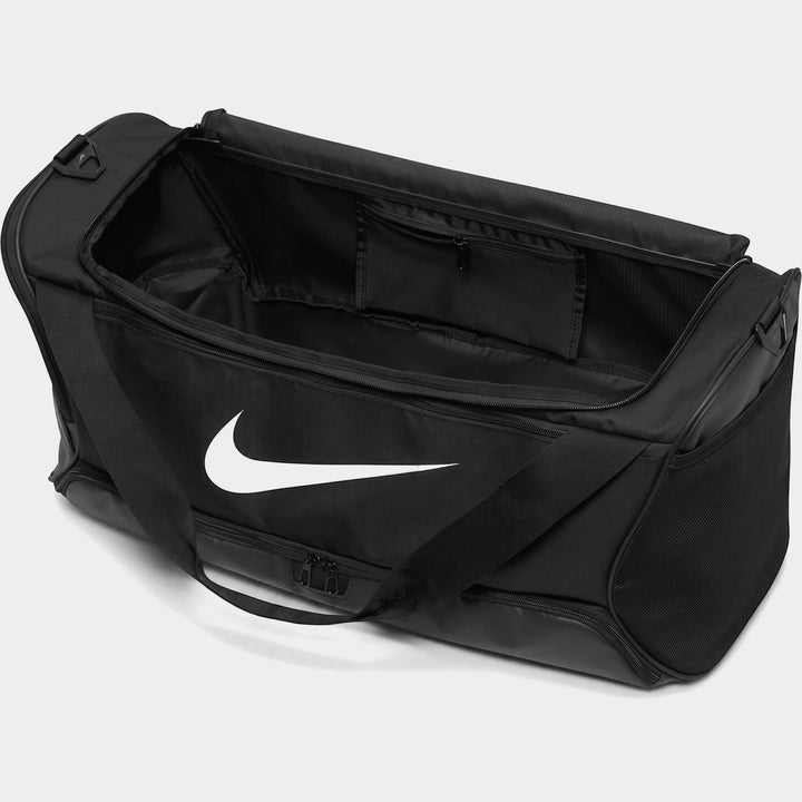 Black Nike Brasilia 95L large duffel bag with white swoosh logo, shown open with internal pockets visible, for sports and